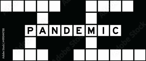 Alphabet letter in word pandemic on crossword puzzle background photo