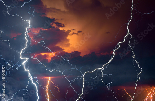 Lightning, thunder and rain during summer storm at night.