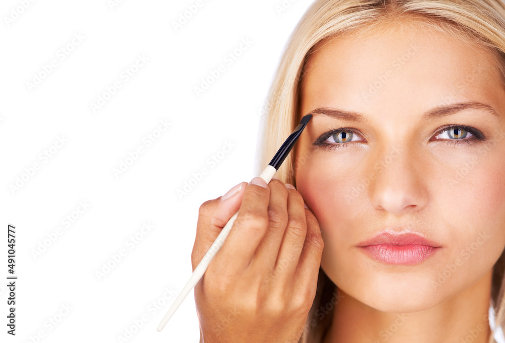Defined brows create a perfect frame. Cropped view of a young woman having brow color added to her eyebrows. Defined brows create a perfect frame. Cropped view of a young woman having brow color added to her eyebrows.