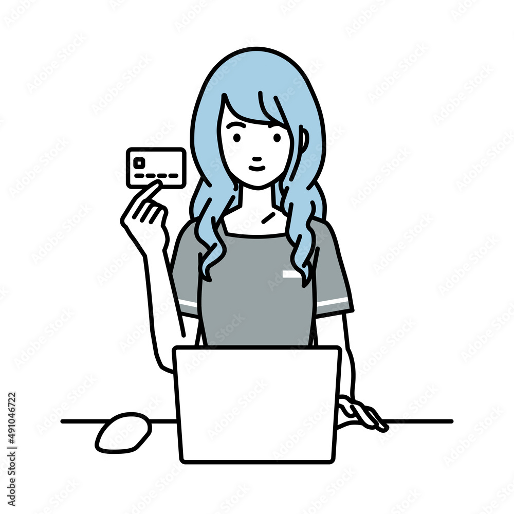 デスクで座ってPCを使いながらクレジットカードを手に持っているエステ店員・受付の女性