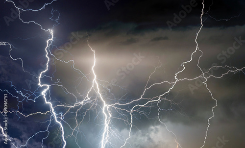 Lightning, thunder and rain during summer storm at night.