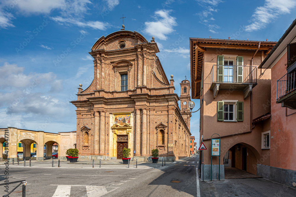Fossano, Cuneo, Italy - March 06, 2022: parish church of San Filippo (18th century) in piazza Aldo Nicolaj with the arcade and the buildings of the historic center