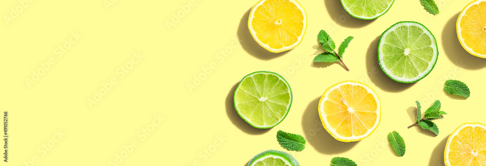 Fresh lemons and limes overhead view - flat lay Fresh lemons and limes overhead view - flat lay