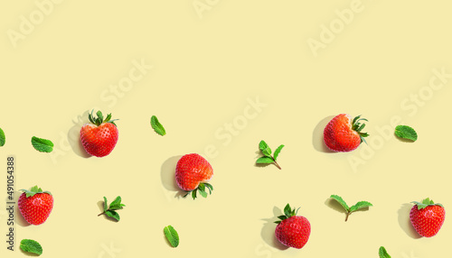 Fresh red strawberries with mints overhead view - flat lay