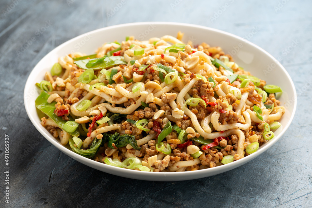 Pork, peanut udon noodles with pak choi, mangetout and red chili. Asian food Pork, peanut udon noodles with pak choi, mangetout and red chili. Asian food