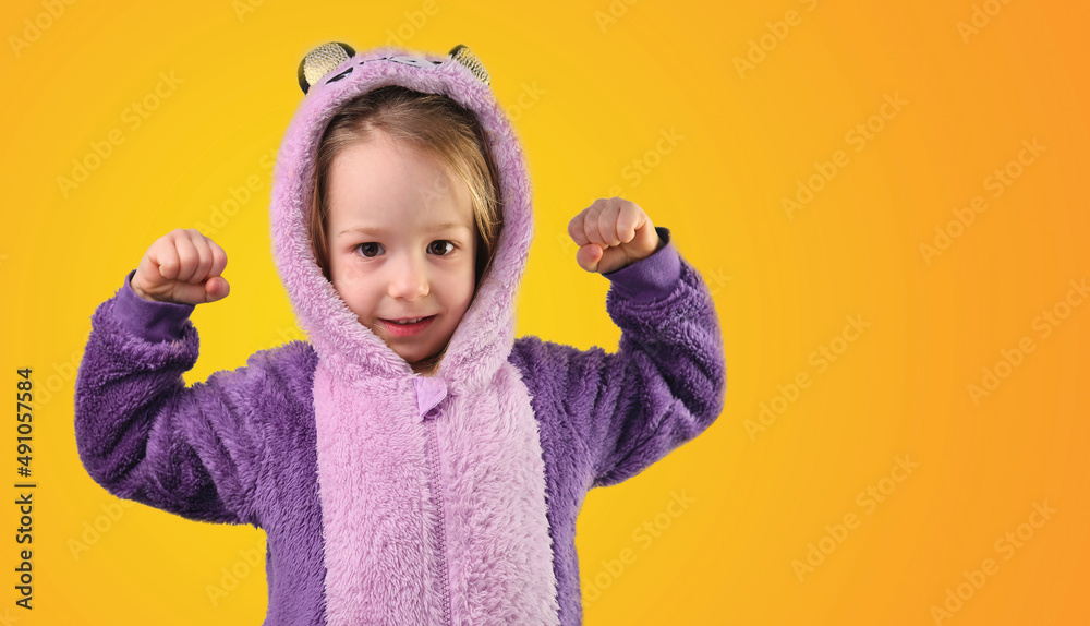 preschool child little shows strong strength tensing muscles in purple pajamas preschool child little shows strong strength tensing muscles in purple pajamas