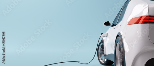 E-mobility, electric car charging battery on blue background. 3d rendering photo