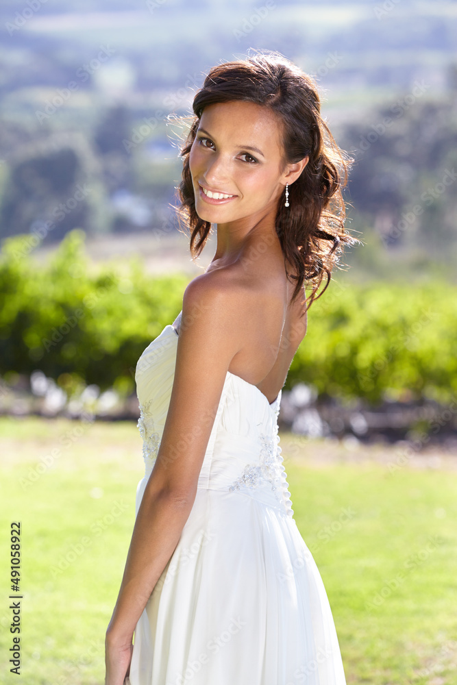 Looking like a true bride. Gorgeous young bride outdoors in her wedding dress. Looking like a true bride. Gorgeous young bride outdoors in her wedding dress.