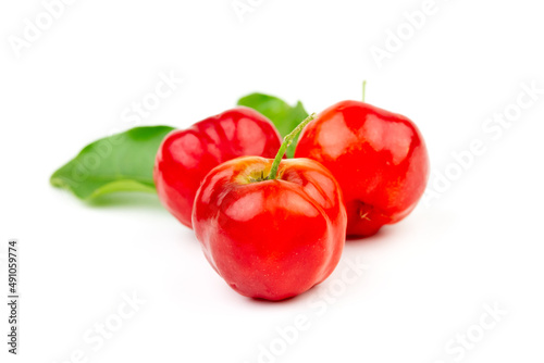 Acerola Cherry or Barbados Cherry with green leaf isolated on white background.