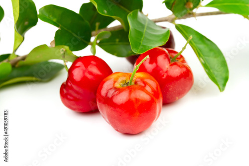 Acerola Cherry or Barbados Cherry with green leaf isolated on white background.