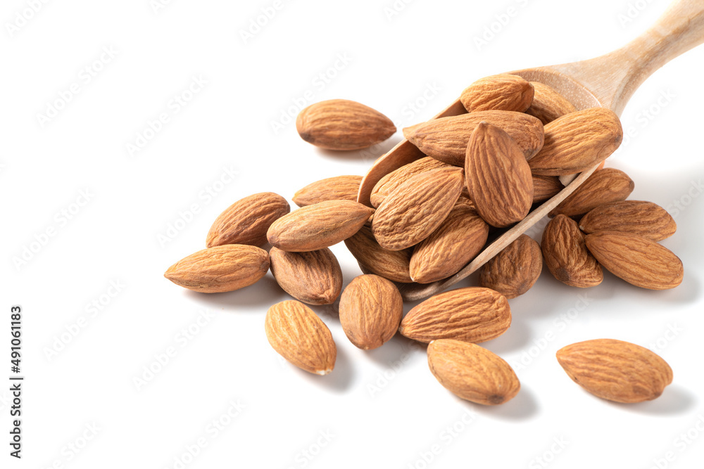 Almonds nut on wood spoon isolated on white background. Almonds nut on wood spoon isolated on white background.