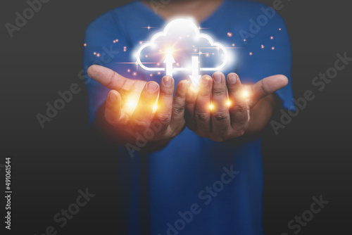 A man holding virtual cloud computing to transfer database information upload, download application. Technology business transformation concept. Innovation to the future.