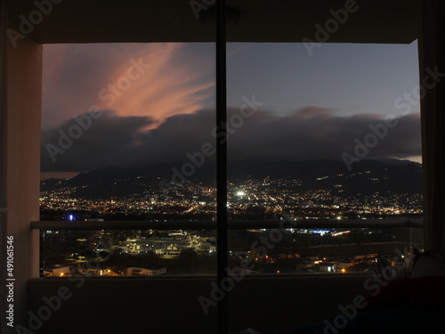 View of San Jos   City during dusk from a room