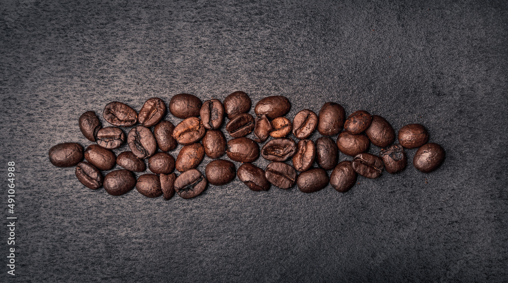 Roasted coffee beans background, close up Roasted coffee beans background, close up