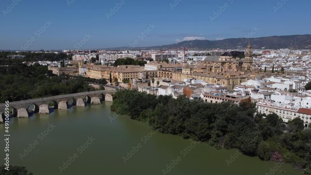 Aerial view of the old medieval city of Cordoba in Andalusia, Spain during a sunny day. Medieval mosque cathedral and Roman bridge over Guadalquivir river, UNESCO World Heritage site. Tourism.
