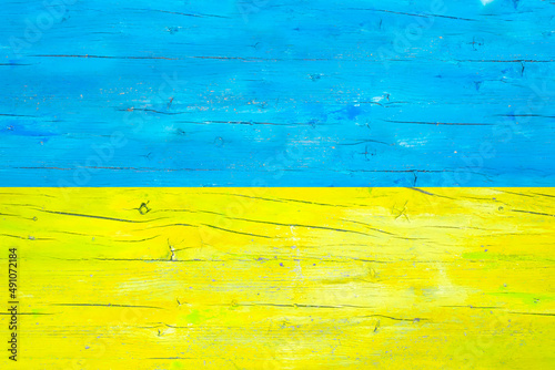 Ukraine national flag on wood texture background