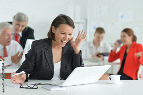 Young woman with a laptop in office