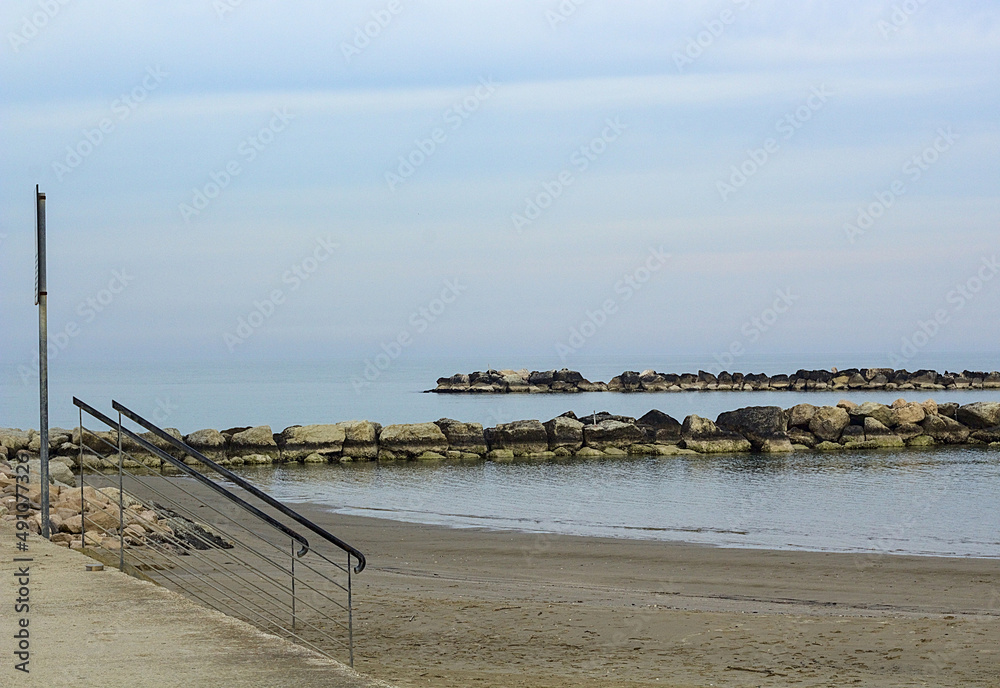 Cliff of an Italian beach on a morning after the rain