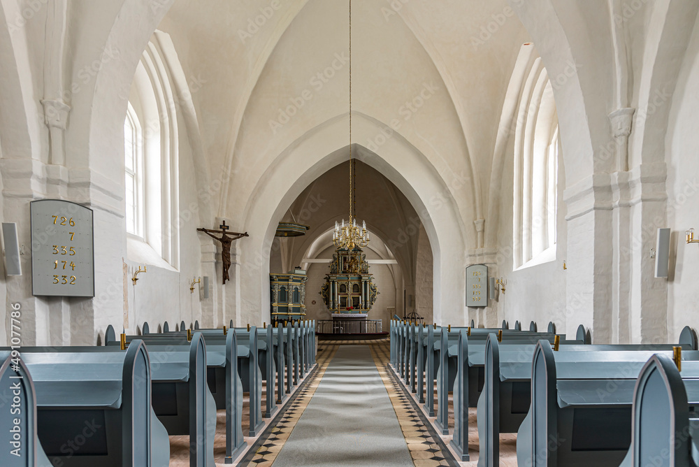 the interior of a white and grey scandinavian church