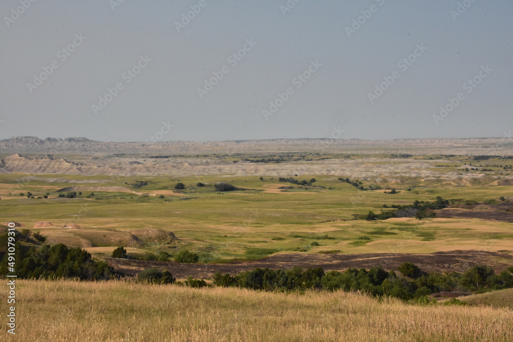 Scenic Landscape Views with Rugged Badlands in the Distance