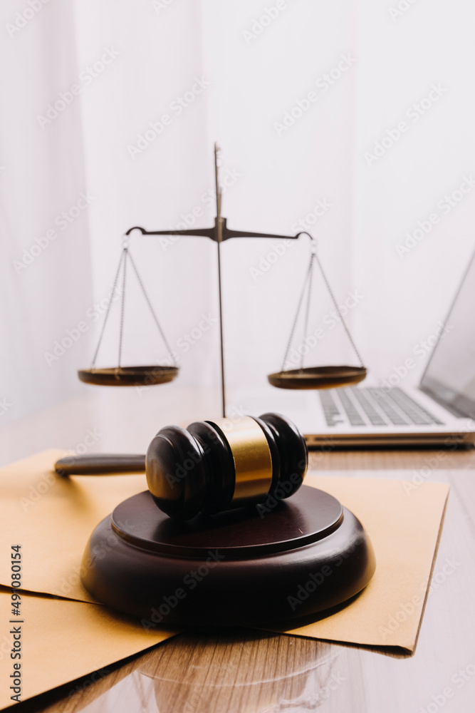 Male lawyer working with contract papers and wooden gavel on tabel in courtroom. justice and law ,attorney, court judge, concept. Male lawyer working with contract papers and wooden gavel on tabel in courtroom. justice and law ,attorney, court judge, concept.