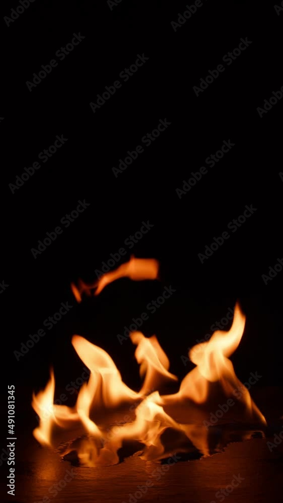 fire bruning on black slate stone. Hot Elements for compositing vertical fire bruning on black slate stone. Hot Elements for compositing vertical