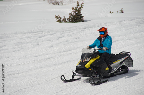 snowmobile rider in the Colorado Mountains on top of Vail pass