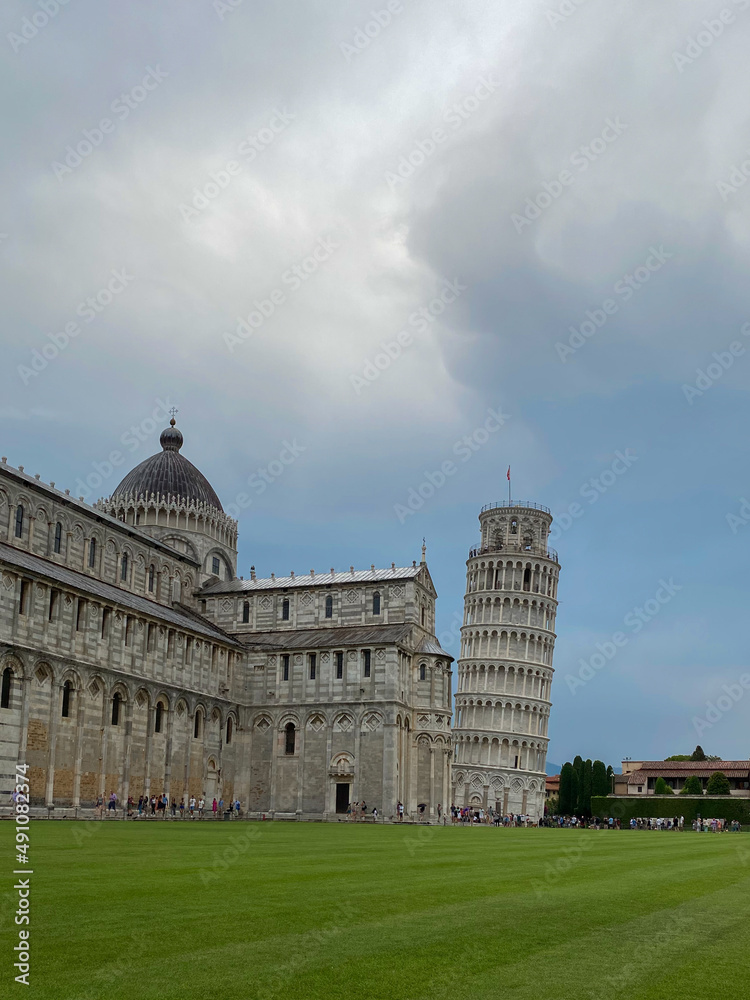 View on the Pisa Tower and the Duomo from Piazza dei Miracoli. Vertical orientation
