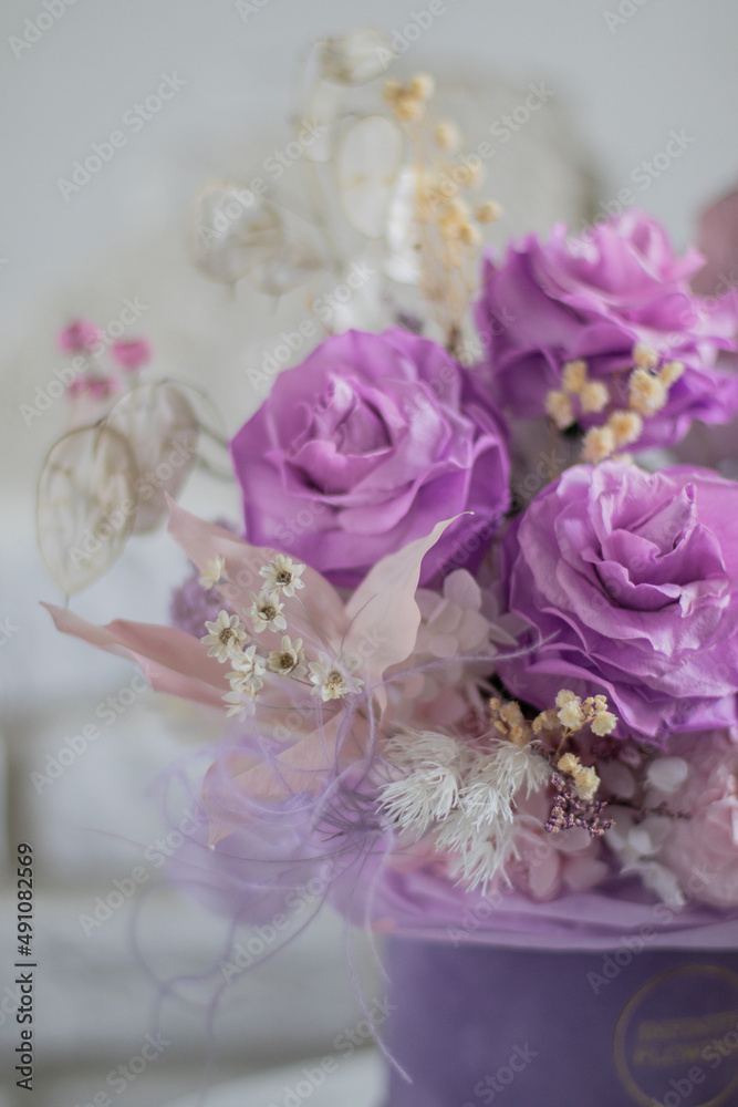 A mix of pink peonies with purple and pink roses on coffee table. Bouquet of tenders peonies a girl for mother's day, valentine's day, Woman's day 8 march. A mix of pink peonies with purple and pink roses on coffee table. Bouquet of tenders peonies a girl for mother's day, valentine's day, Woman's day 8 march.