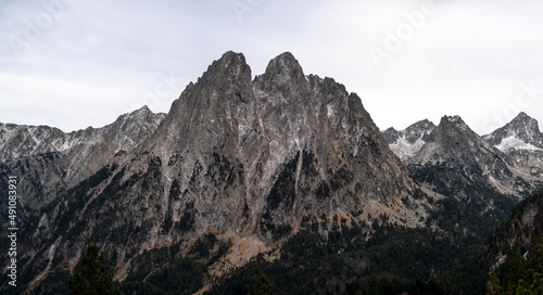 dark high alpine peak with sharp rocky formation high resolution panoramic shot 