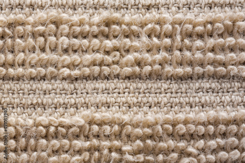 Macro of soft textile, Close up of short pile brown carpet woven, Fluffy fiber fabric cloth feels warm and comfortable.