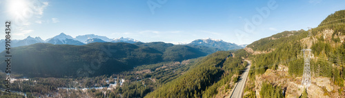 Aerial Panoramic View of Sea to Sky Highway in a valley by mountains. Sunny Winter Day. Located between Whistler and Squamish, British Columbia, Canada. © edb3_16
