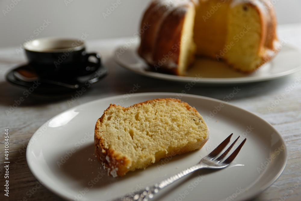 Close up of piece of cake on plate. A Gugelhupf, a traditional sponge cake from Bavaria and Austria.