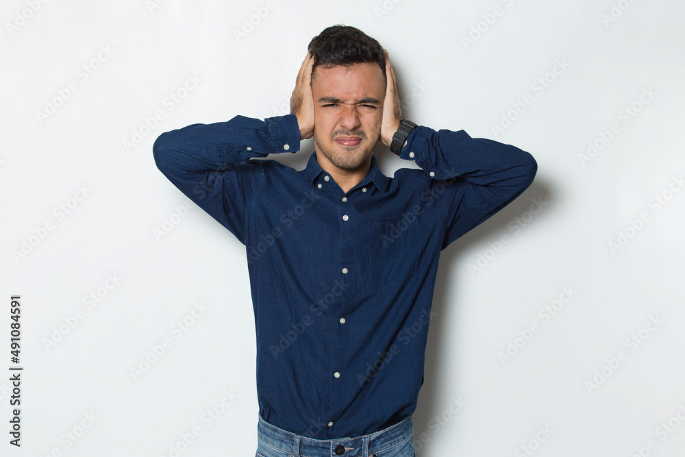 young business man covering both ears with hands isolated on white background
young business man covering both ears with hands isolated on white background