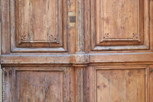 old wooden brown door with handle, background 