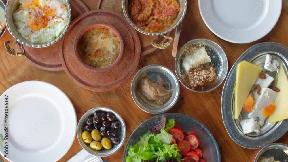 Traditional rich Turkish village breakfast on the wooden table Traditional rich Turkish village breakfast on the wooden table