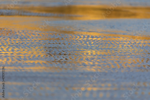 Reflection of the sunset on...