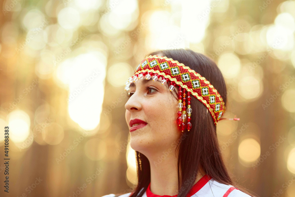 a girl in national Chuvash clothes in a pine forest a girl in national Chuvash clothes in a pine forest