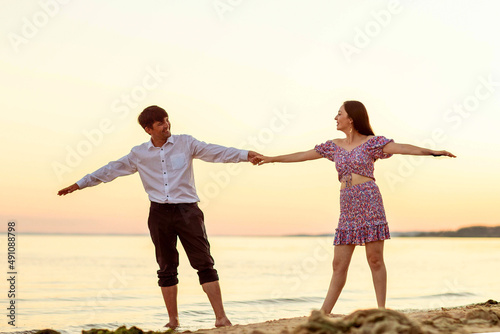 a girl and her boyfriend on the river bank © artem