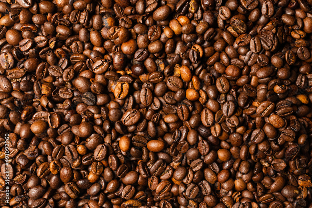 Coffee beans on a white background. Top view. Coffee beans on a white background. Top view.