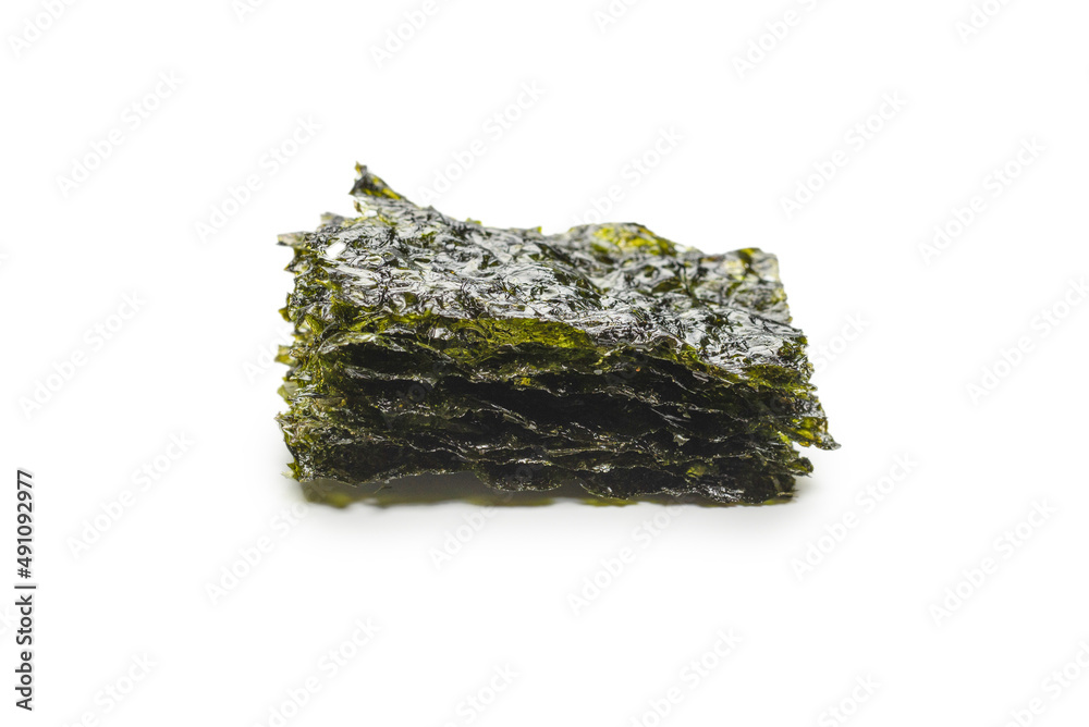 Tasty nori seaweed isolated on white. Tasty nori seaweed isolated on white.
