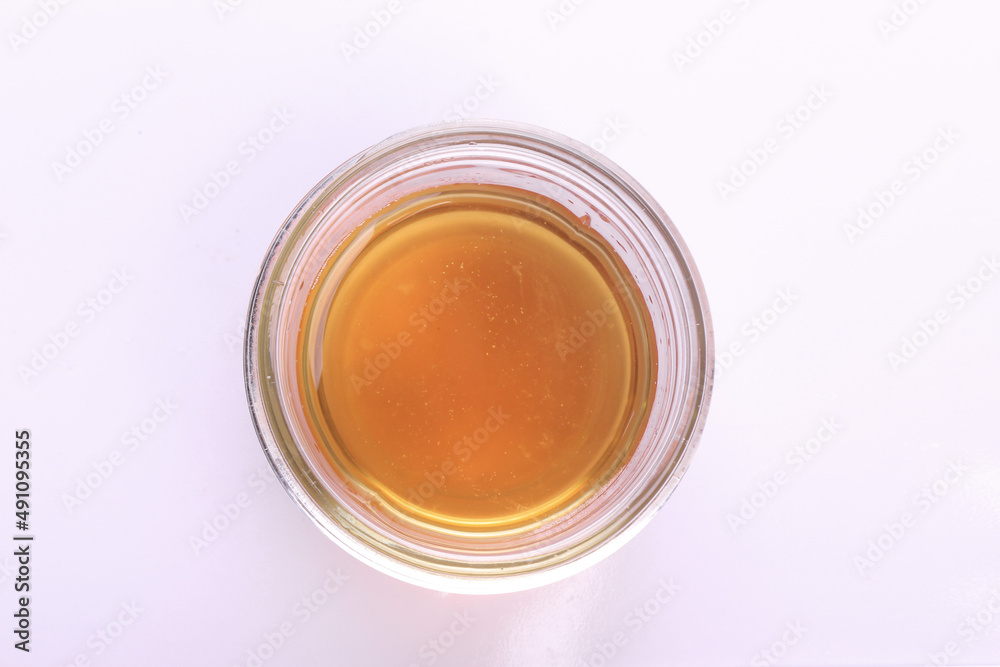 Top view of cooking oil in glass bowl isolated on white. Top view of cooking oil in glass bowl isolated on white.