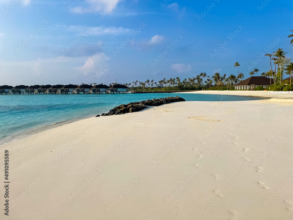 footprints on wet sand. Maldives beach hotel background footprints on wet sand. Maldives beach hotel background