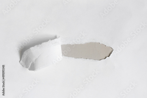 torn white paper as background, space for text