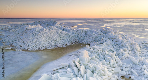Aerial view to the high mounds of sea ice, stacked up on coast by heavy early spring storm in Pikla, Luitemaa NR, Häädemeeste, Pärnu county, Estonia photo