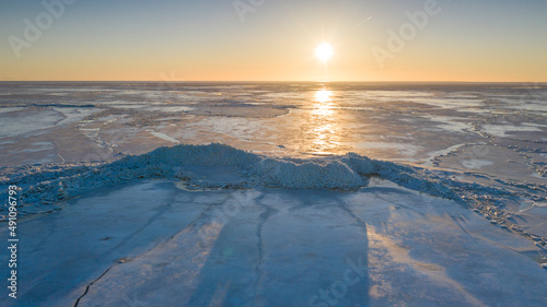 Aerial view to the high mounds of sea ice  stacked up on coast by heavy early spring storm in Pikla  Luitemaa NR  H    demeeste  P  rnu county  Estonia