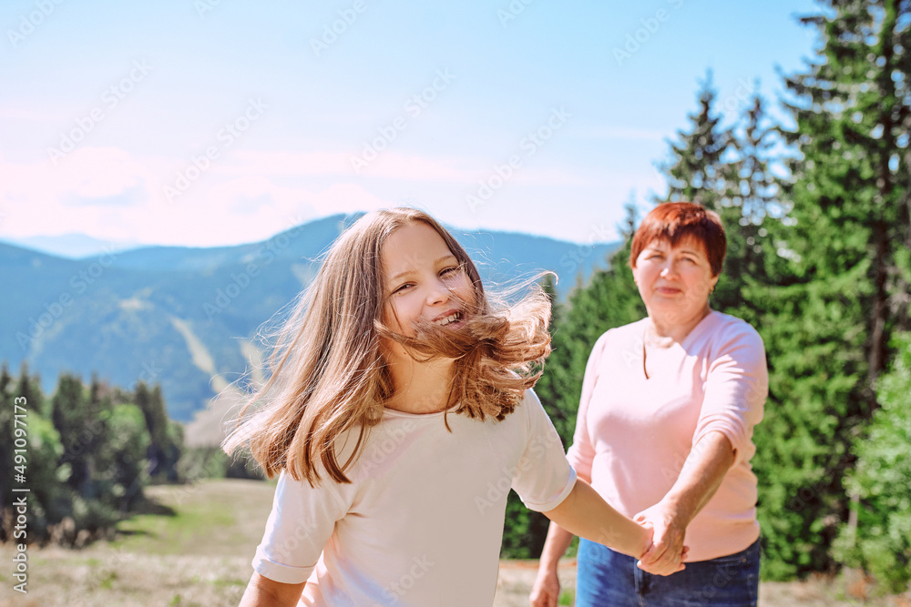 family grandmother and mother in mountains happy to travel. Leisure family time, summer concept family grandmother and mother in mountains happy to travel. Leisure family time, summer concept