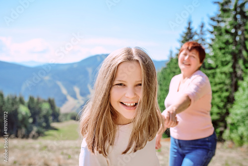 family grandmother and mother in mountains happy to travel. Leisure family time, summer concept