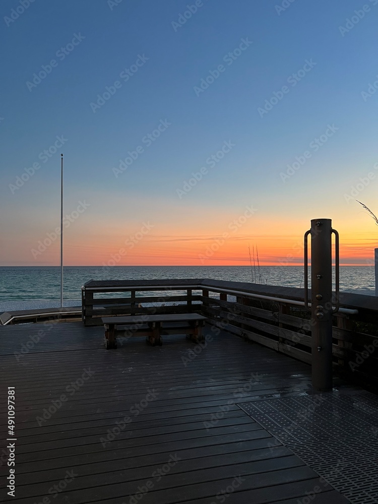 outdoor shower area on the beach with sunset sky background 