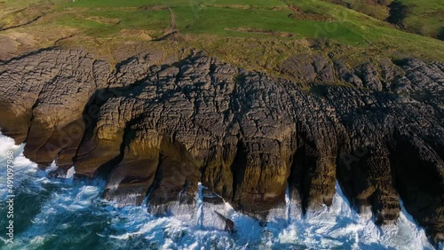 Landscape of the coastal cliffs in the surroundings of the Ajo Lighthouse and the Cuberris beach. Garlic, Cantabria, Spain, Europe photo